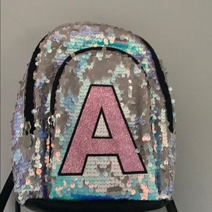 Justice sequin initial mini backpack